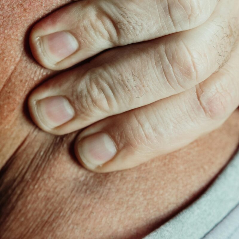 Man Holding Neck From Neuropathy