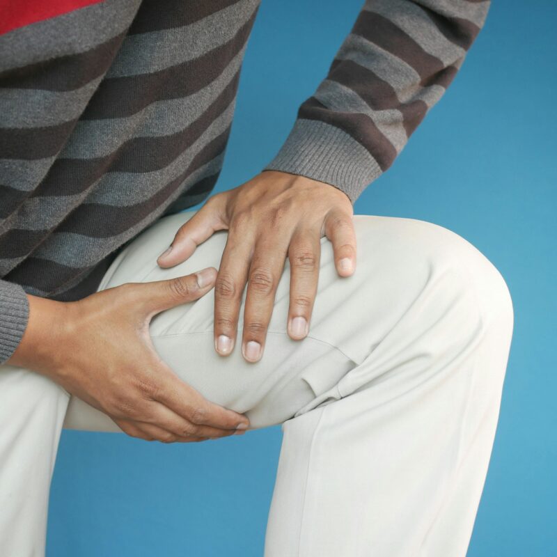 Person holding their knee
